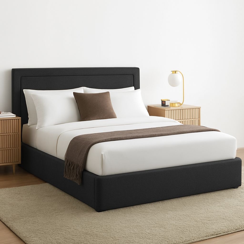 Bedroom with a black bed frame, white bedding, and brown throw blanket.